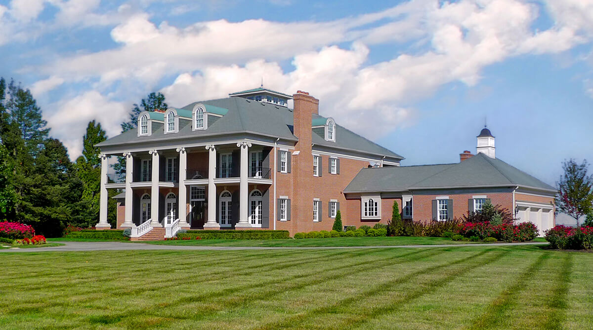 Angle View of Front Exterior of Antebellum Plantation Style Home in Higginsville, Missouri Designed by NSPJ Architects