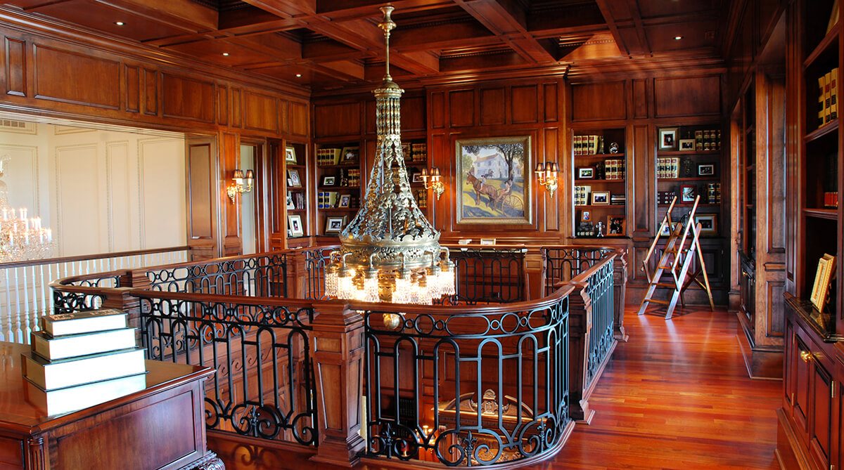 Second Floor of Library and Chandelier in Antebellum Plantation Home in Higginsville, Missouri Designed by NSPJ Architects