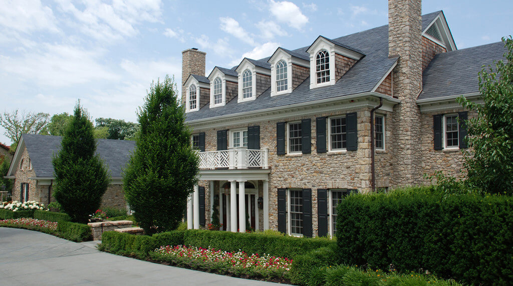Exterior of a Leawood, Kansas home designed in the Georgian style. Architecture and Landscape Architecture by NSPJ Architects.