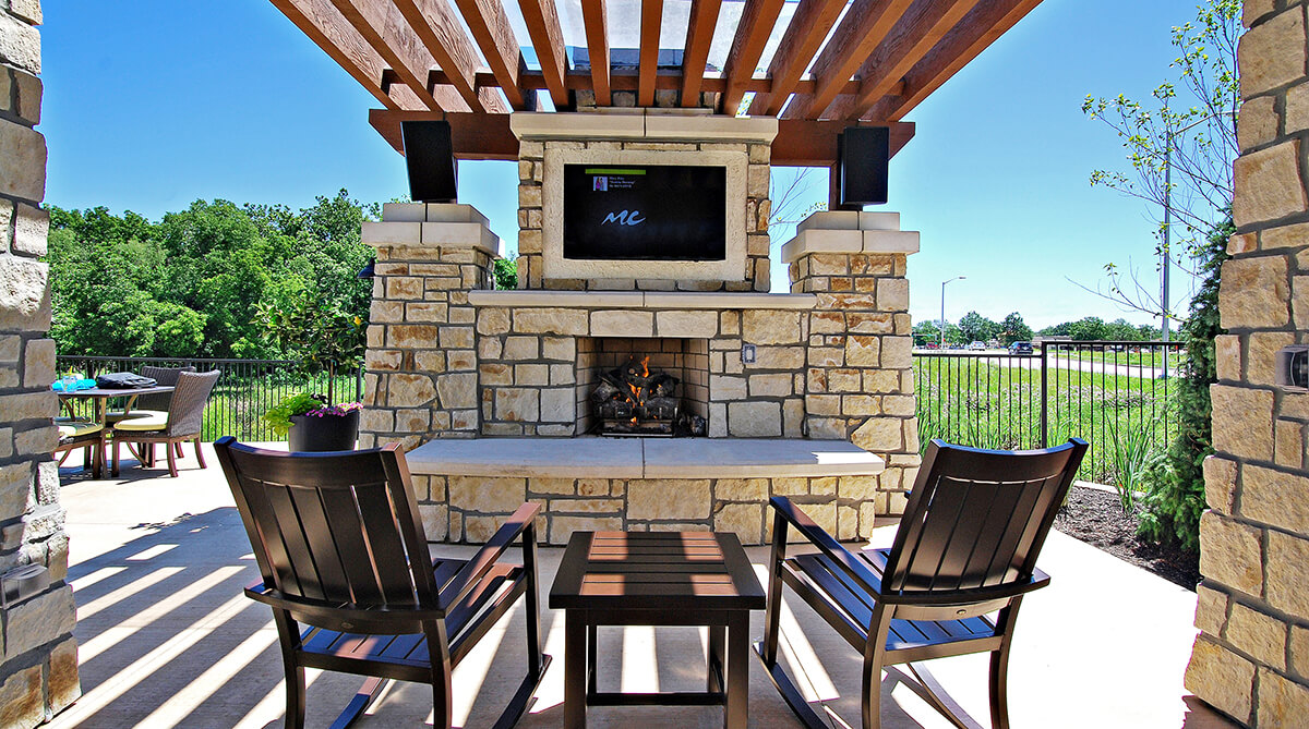Outdoor fireplace at Highlands Lodge Apartments, designed by NSPJ Architects