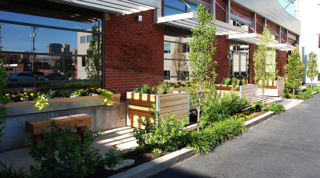 Outdoor office landscape with wooden planters. Landscape architecture by NSPJ Architects.