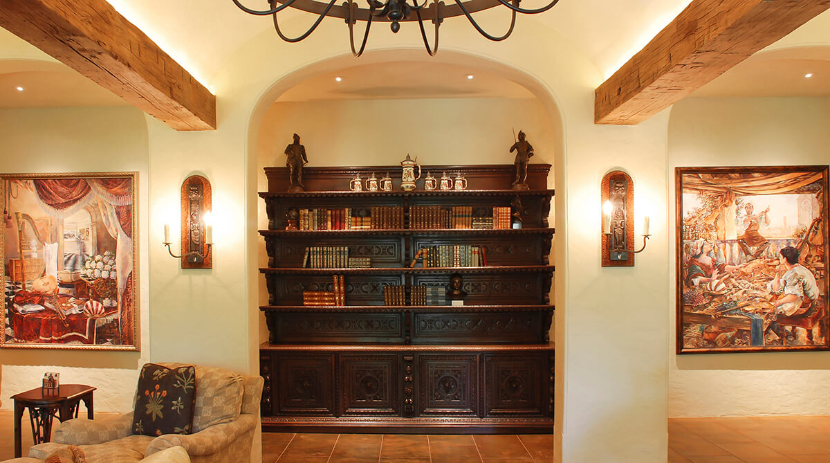 Great Room Bookcase in Tuscan Farmhouse Designed by NSPJ Architects