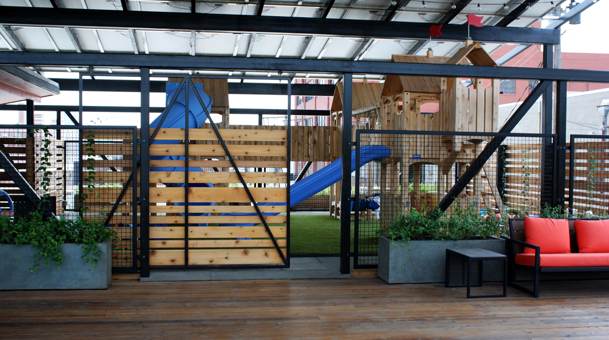 Outdoor playscape on the roof of a downtown Kansas City office. Landscape architecture by NSPJ Architects.