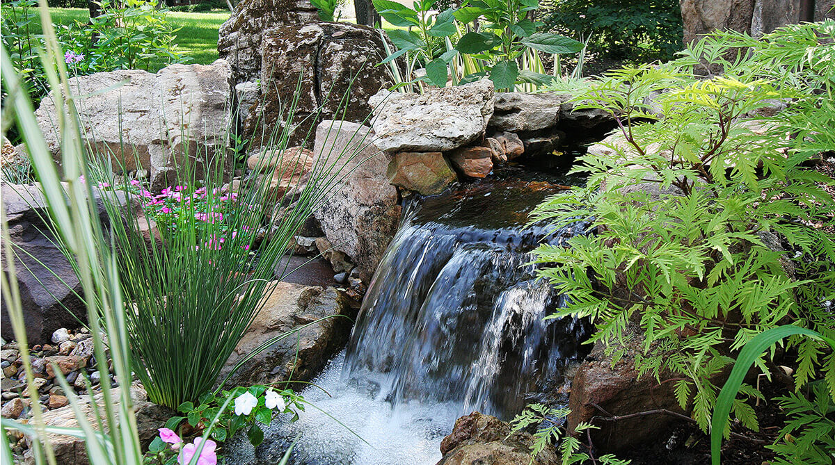 Waterfall in Secret Garden in Overland Park, Kansas Designed by NSPJ Architects