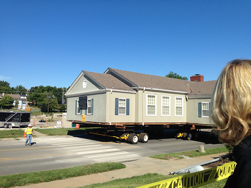 The clubhouse on the flatbed trucks, slowly making its way to its new location.