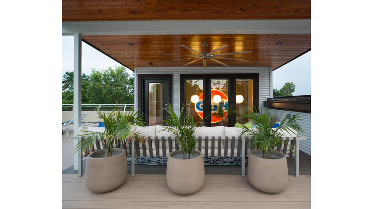 Outdoor entertaining space on the second floor roof of this modern Kansas City home. Architecture, landscape architecture and interior design by NSPJ Architects.