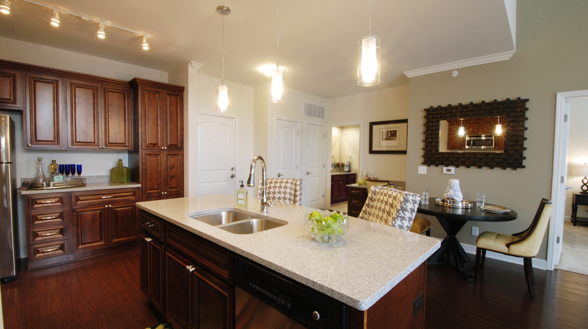 Kitchen in unit of Mission 106 in Leawood, Kansas, designed by NSPJ Architects