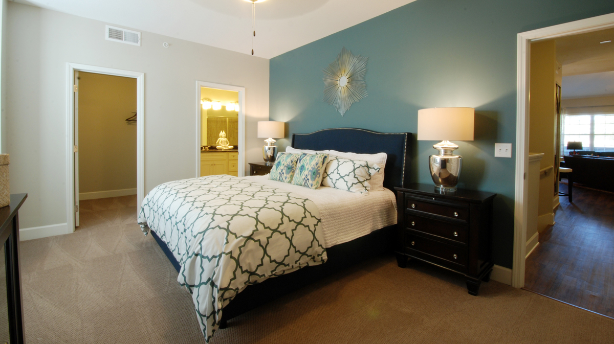Bedroom in master suite of Villa Milano in Leawood, Kansas, designed by NSPJ Architects