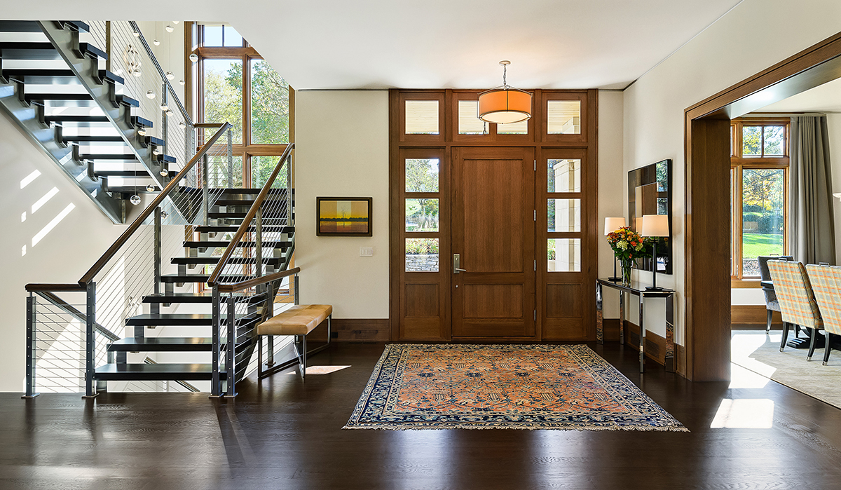 Prairie-Style Contemporary entry door and staircase