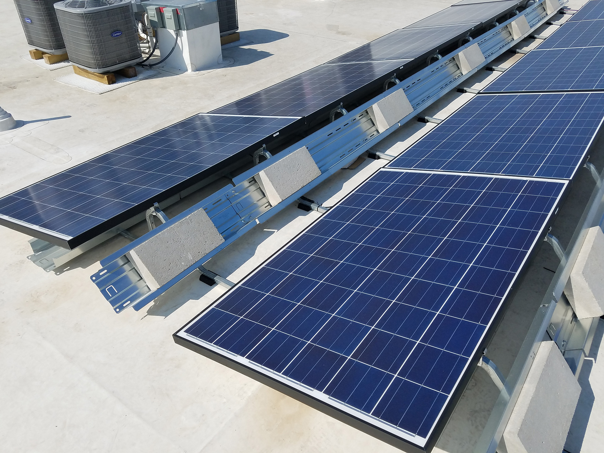 Detail of Energy-Efficient Solar Panels on the Roof of Centropolis on Grand | NSPJ Architects