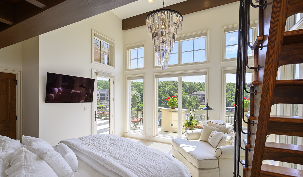Guest Bedroom at the Lake of the Ozarks Luxurious Home designed by NSPJ Architects