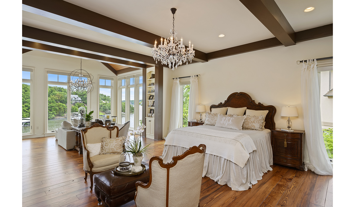 Master Bedroom at the Lake of the Ozarks Luxurious Home designed by NSPJ Architects